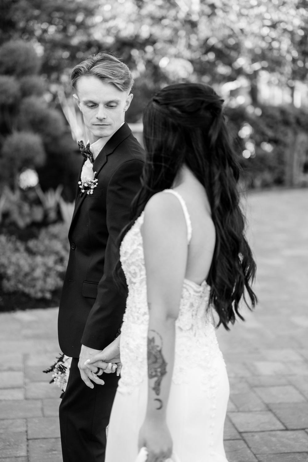 A romantic black and white wedding photo sequence showing a couple sharing intimate moments.