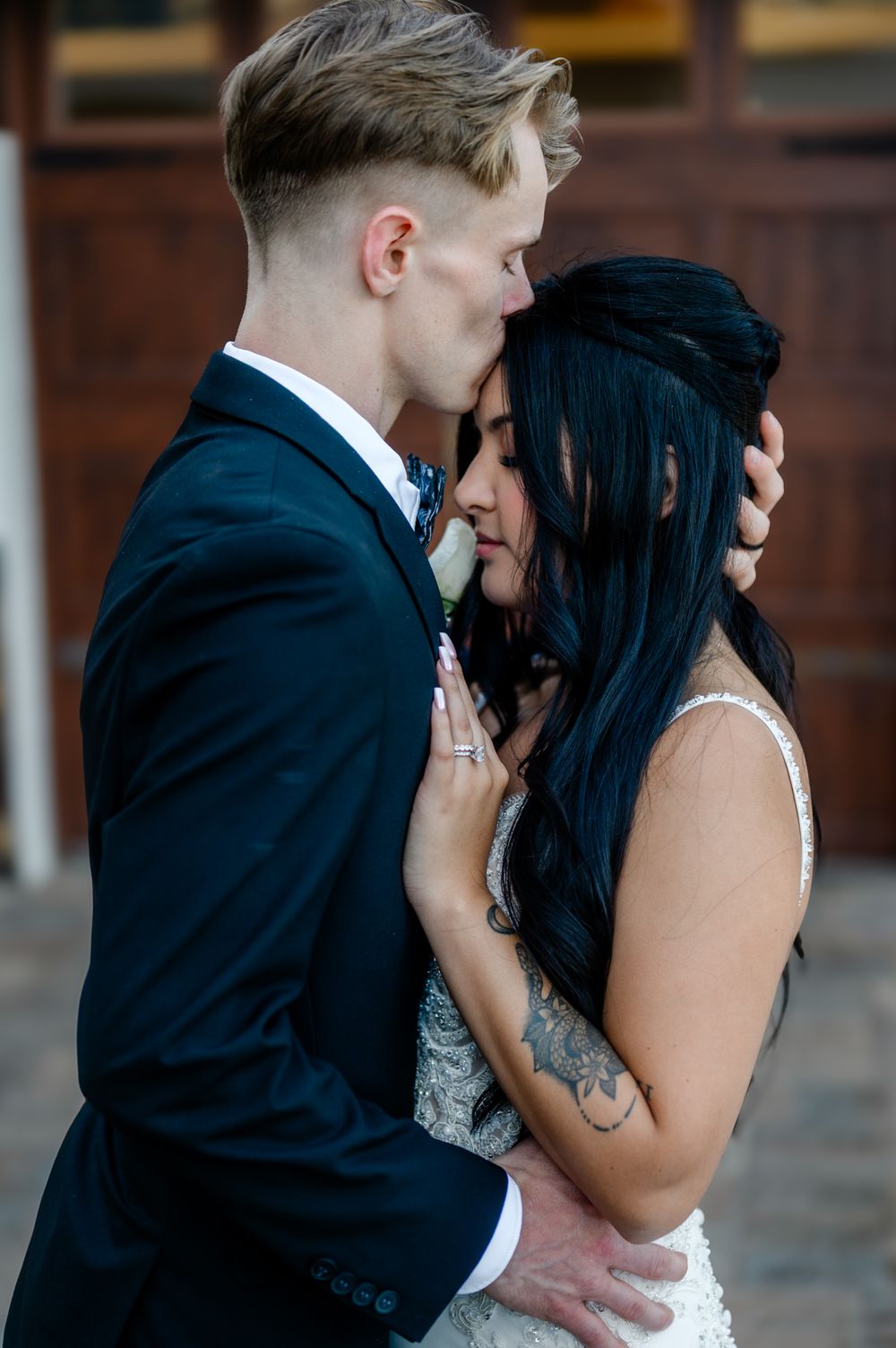 A series of tender wedding photos showing a couple in black and white embracing.