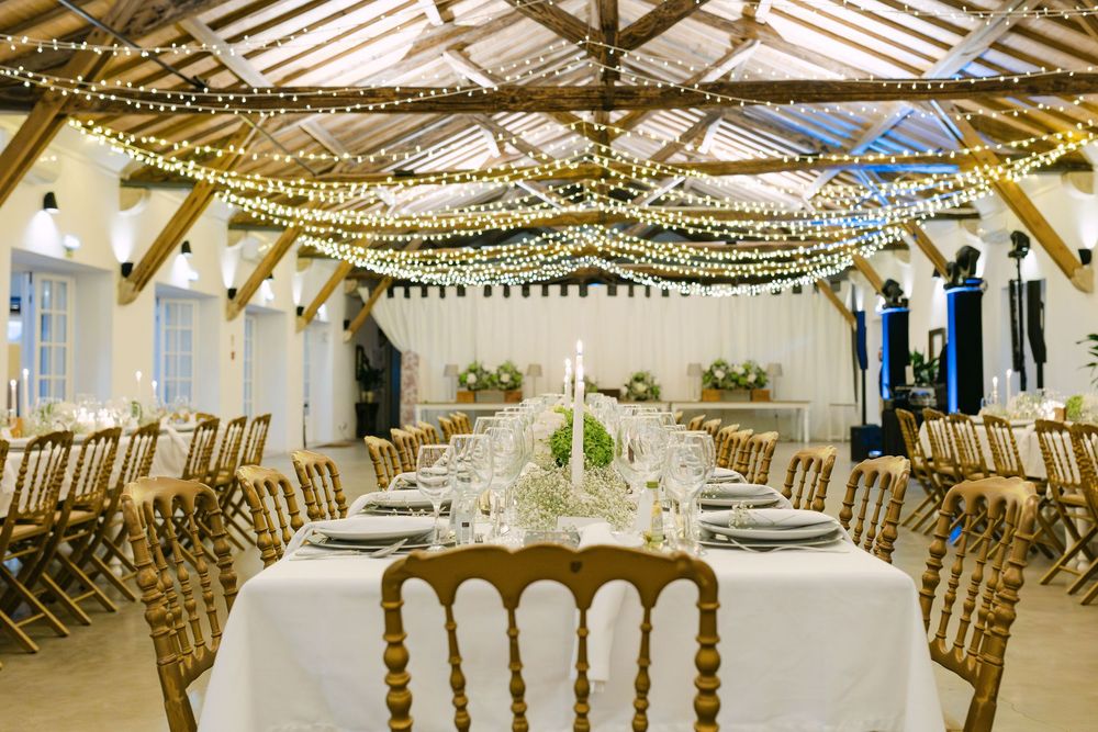 Wedding reception dinner setup with long tables and fairy lights at Quinta Nova do Hespanhol Lisbon