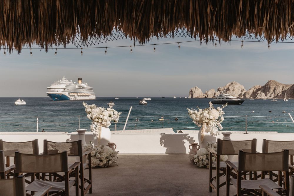 A collage of luxury beach wedding scenes showing decorated tables, boats, and oceanfront ceremony setups in Cabo San Lucas.
