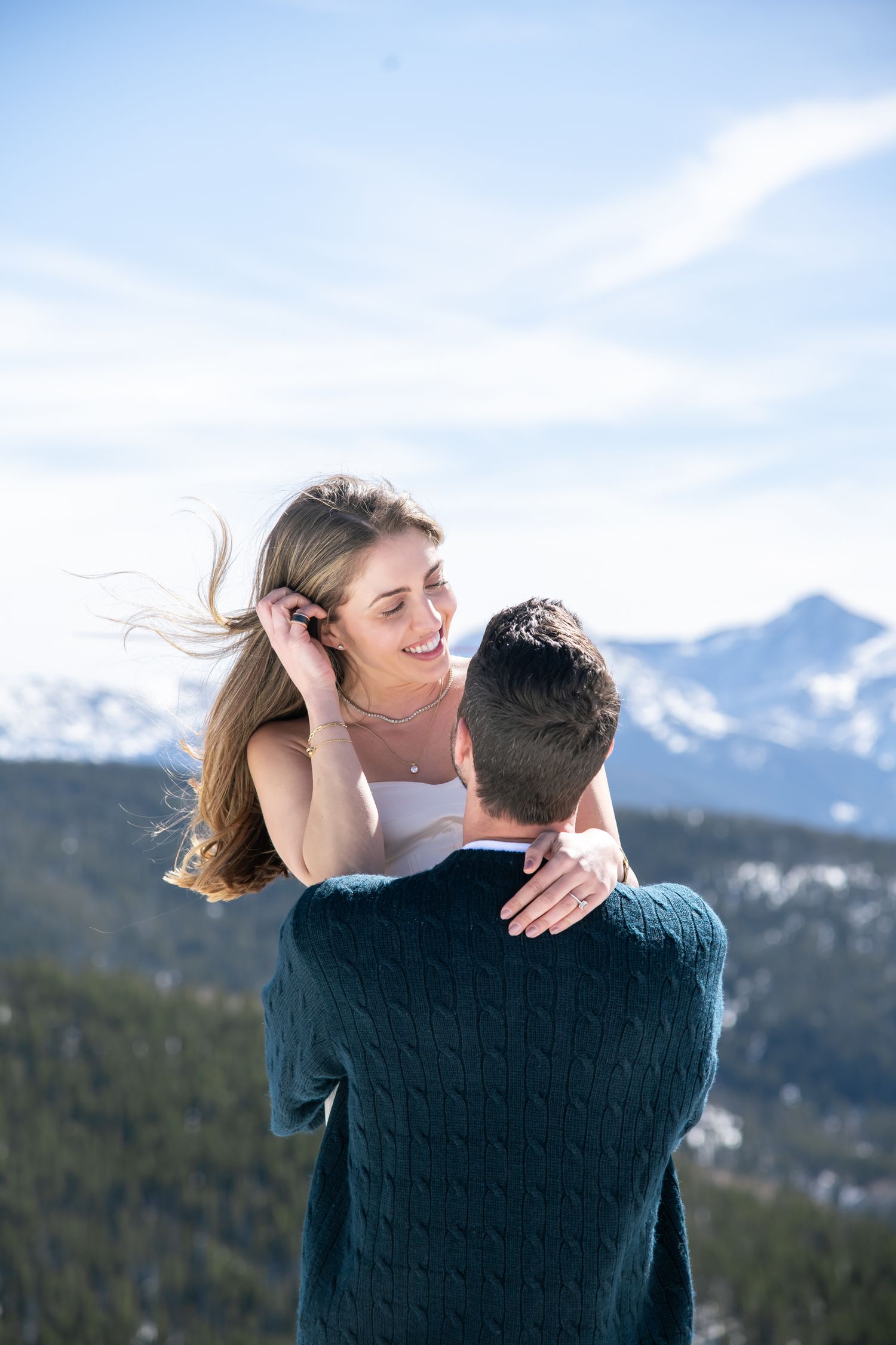 Cute couple during their winter engagement photos in Vail Colorado.