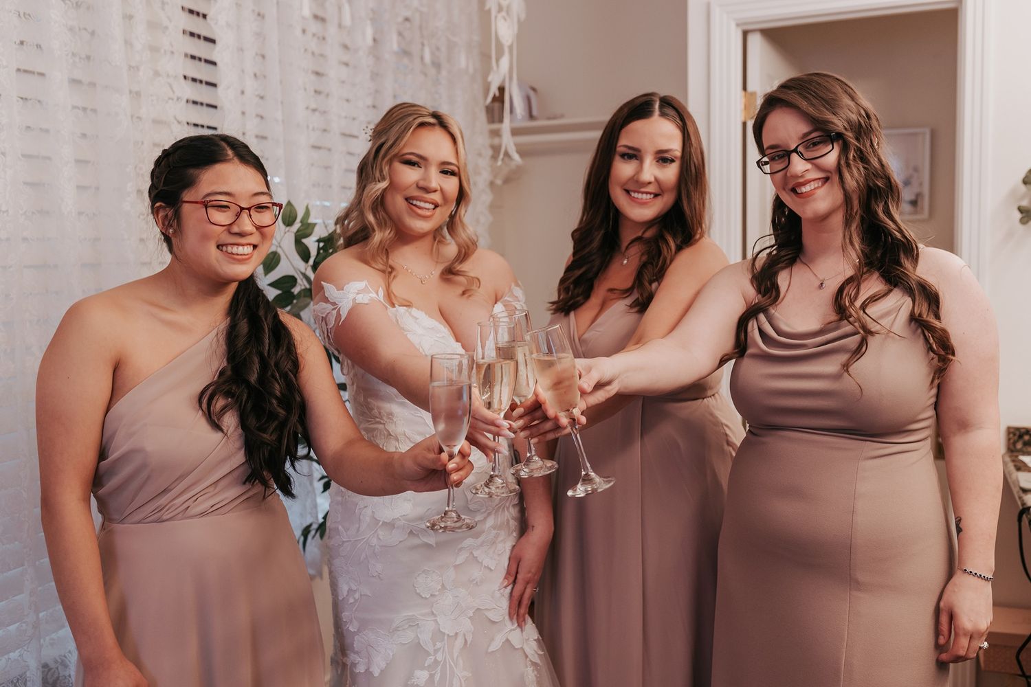 A group in formal attire raises champagne glasses for a celebratory toast at an elegant wedding event at Singing Hills Golf Resort.