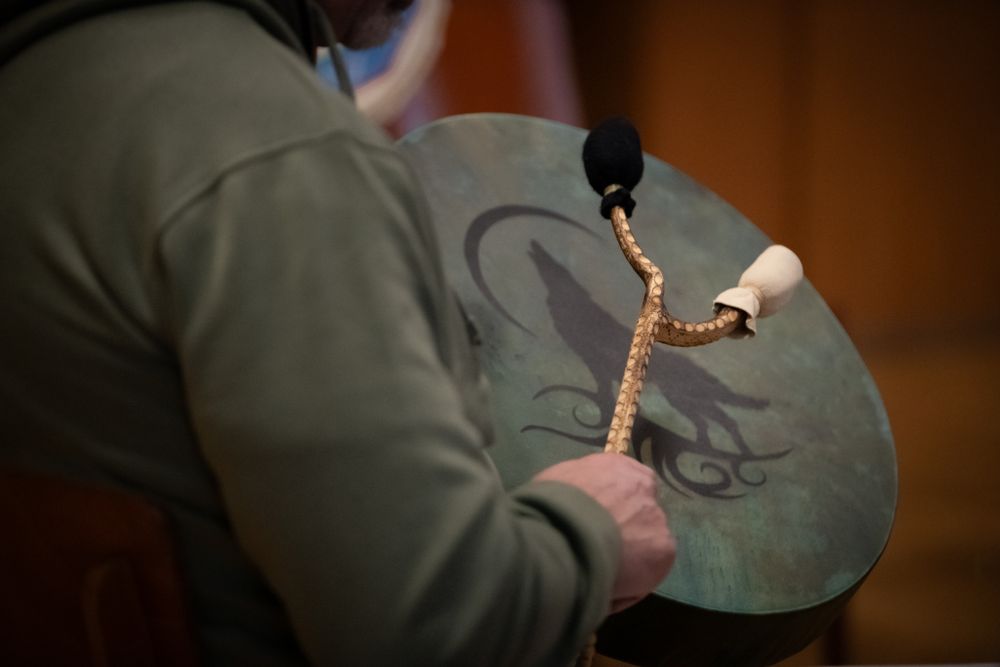 Image of a mans arm banging a drum with a stick from a soul drumming session. Shot at Newbridge, South Wales