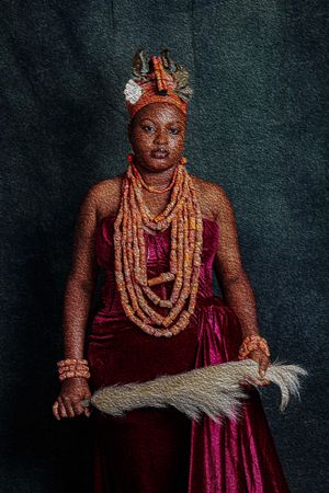 Photography Oil painting of Benin bride featuring coral beaded necklaces, velvet dress, and ornate headdress in a regal portrait.