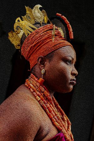Photography Oil painting highlighting golden crown and coral beaded necklaces in traditional African royal portraiture of a Benin bride.