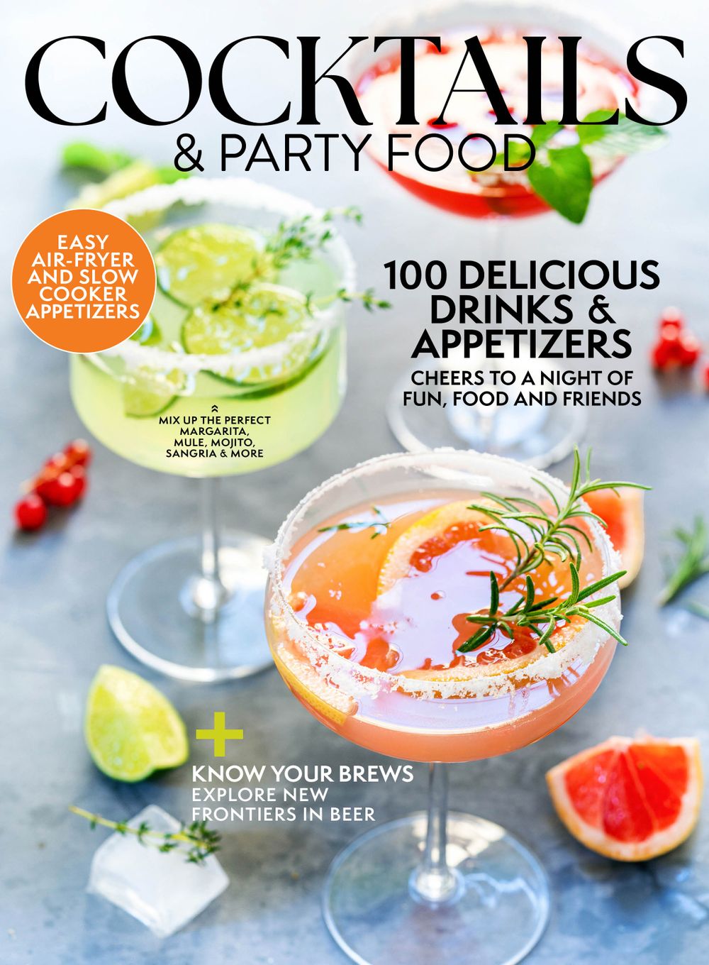 Colorful cocktails and party appetizers with citrus garnishes displayed on a bright blue surface.