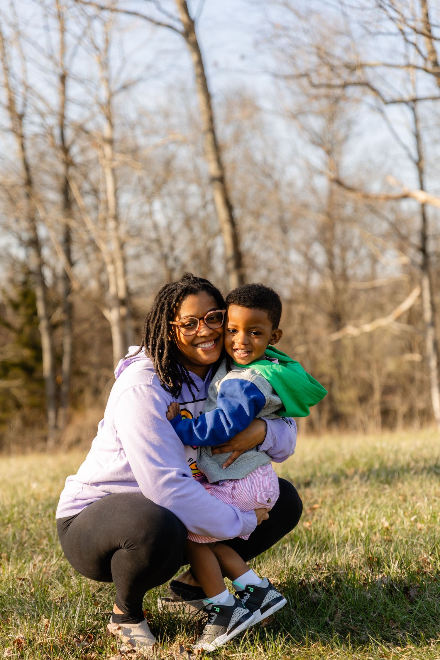 A joyful family moment captured in a series of candid outdoor photos on a grassy field.