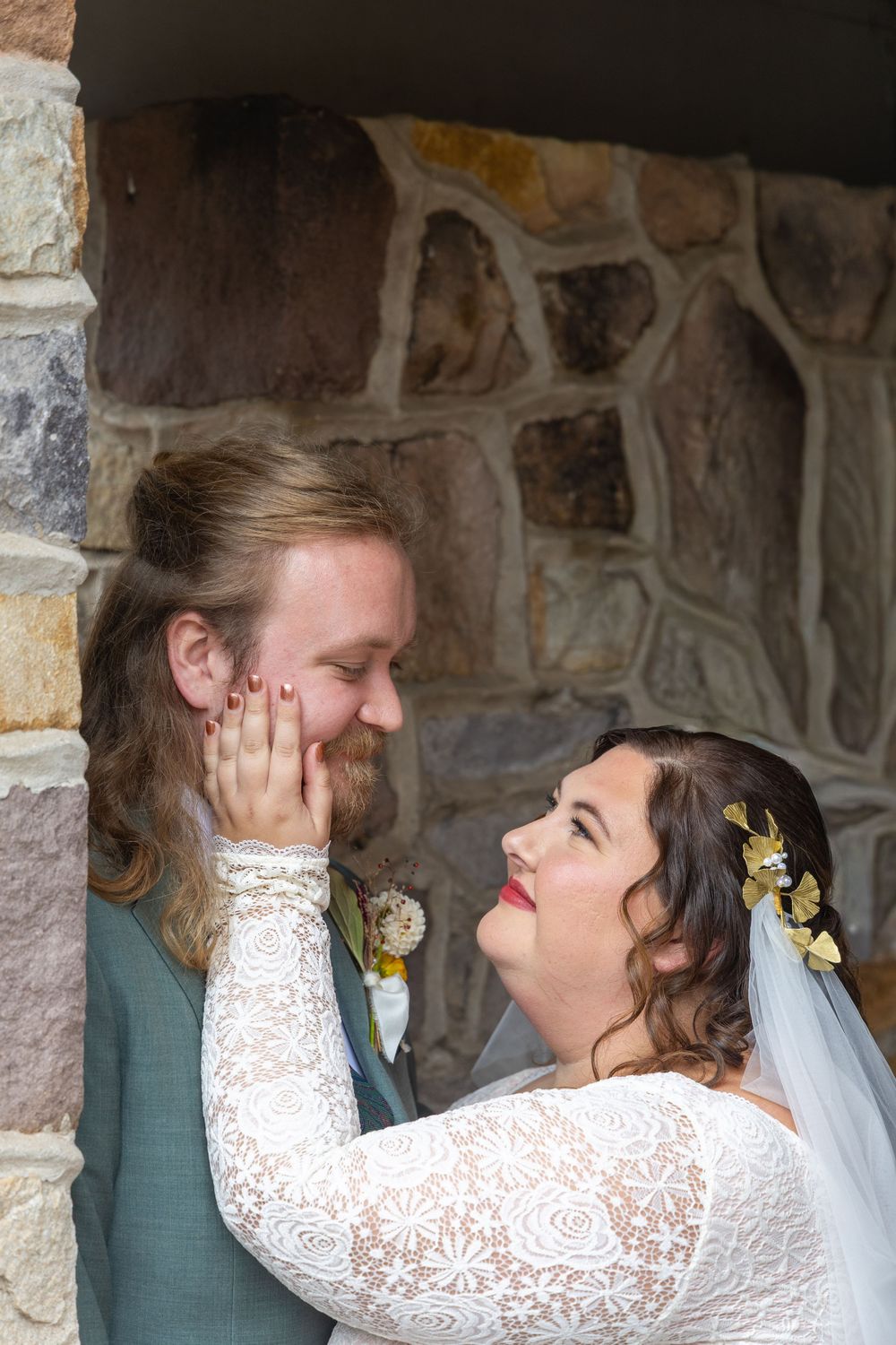 A romantic sequence of wedding photos showing tender moments between newlyweds against a stone wall backdrop.
