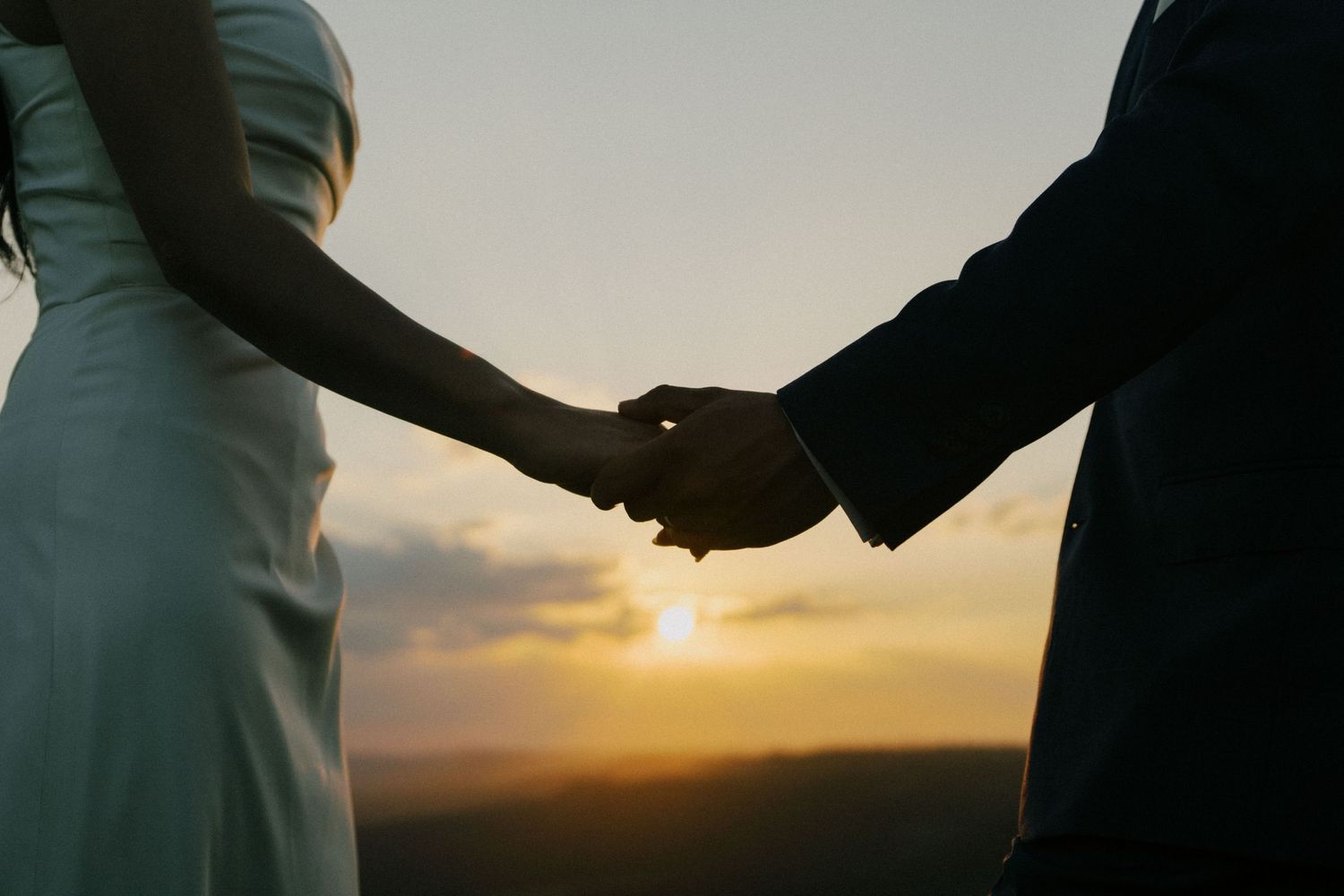 Couple holding hand in sunset, Brisbane wedding photography