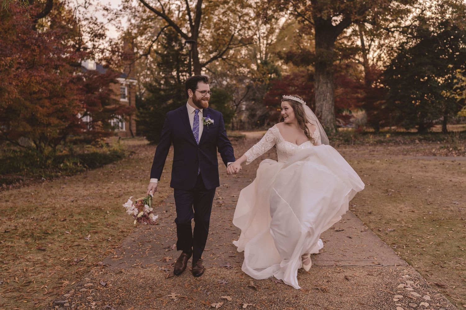 Bride and groom joyfully running at The Borden House at Fletcher Park in Raleigh, NC