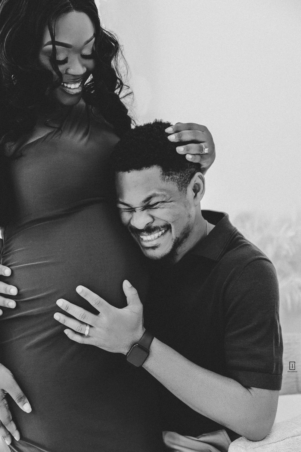 Black and white intimate maternity moment capturing joy and anticipation.