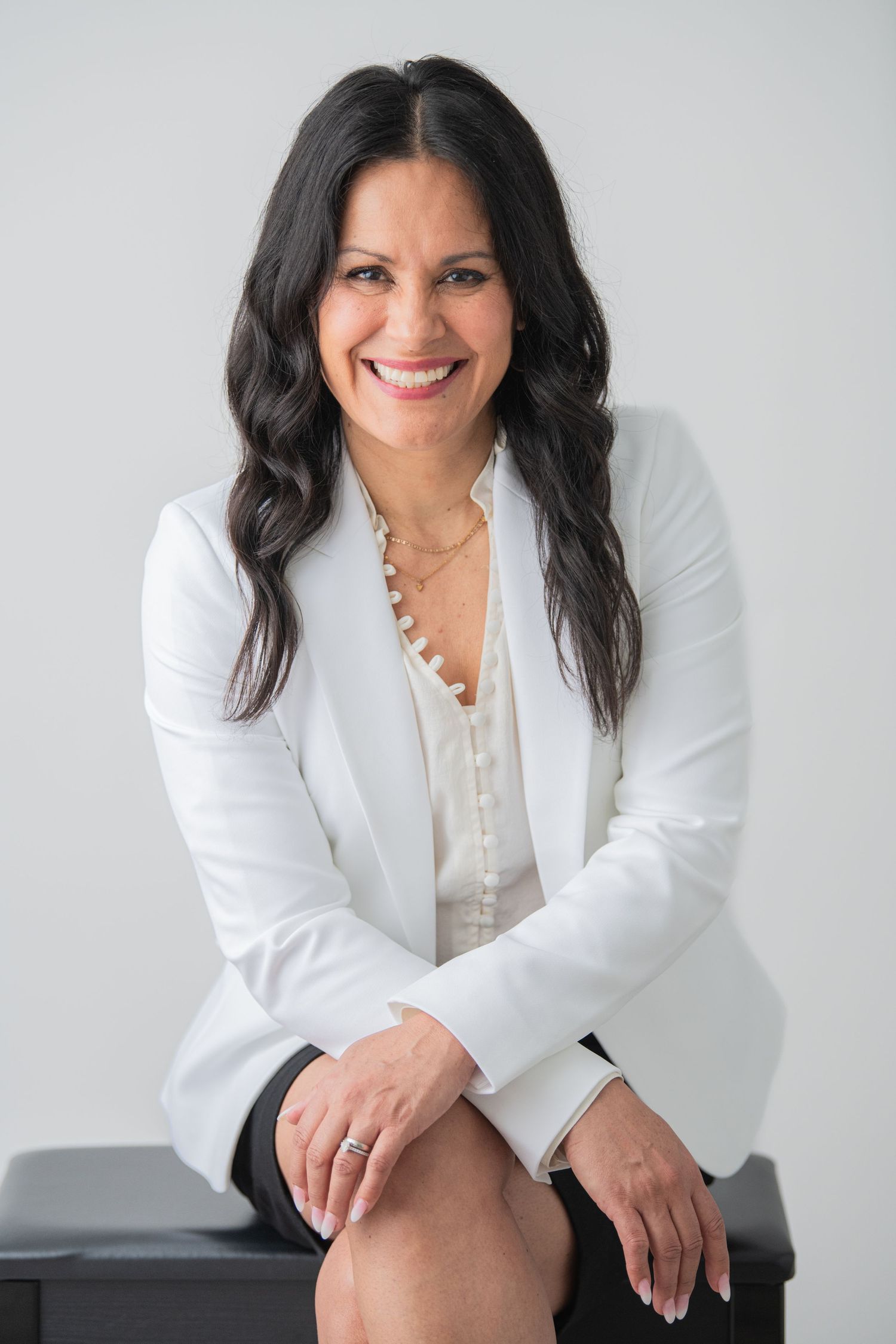 A very professional lady captured in a studio headshot, showcasing elegance and confidence, perfect for personal branding and high-quality p
