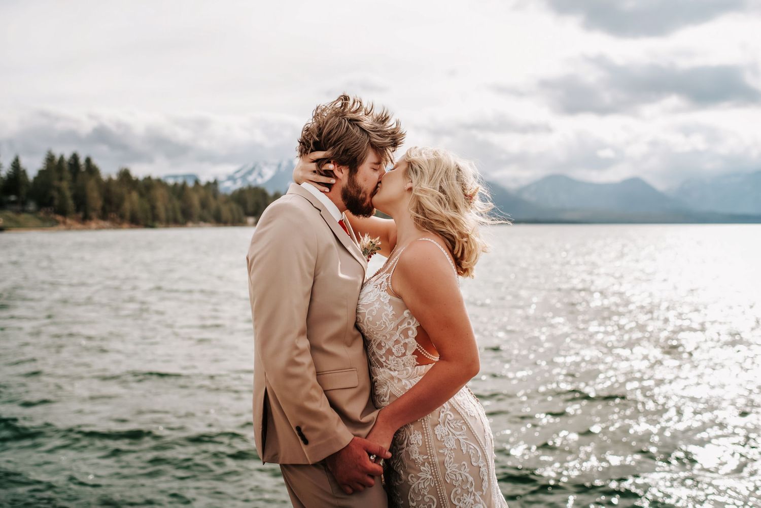 Emotional sunset embrace during a Lake Tahoe elopement, with golden light filtering through pine trees - raw, documentary-style photography.