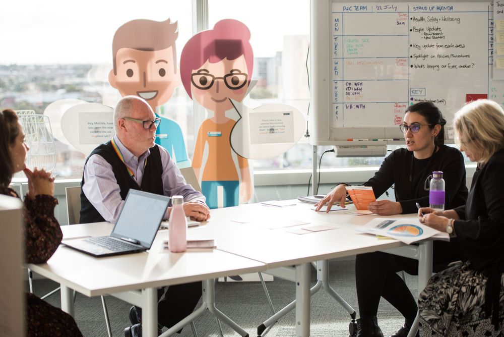 people sitting in a meeting
