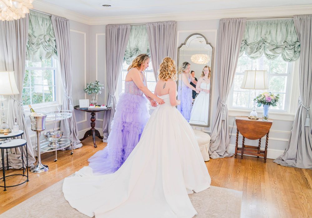 Elegant bridal preparation room with floor-length mirrors and soft gray curtains. The Highgrove Estate, Fuquay-Varina, NC