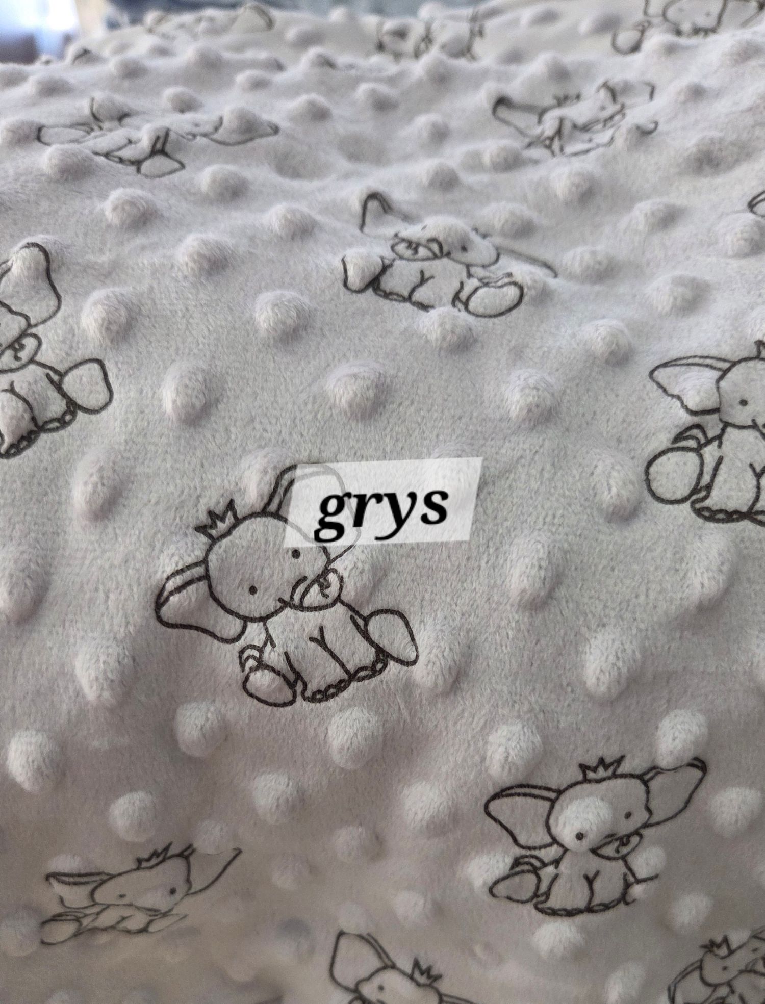 Gray minky dot baby blanket with cute elephant print pattern, soft textured fabric with raised bubble dots.