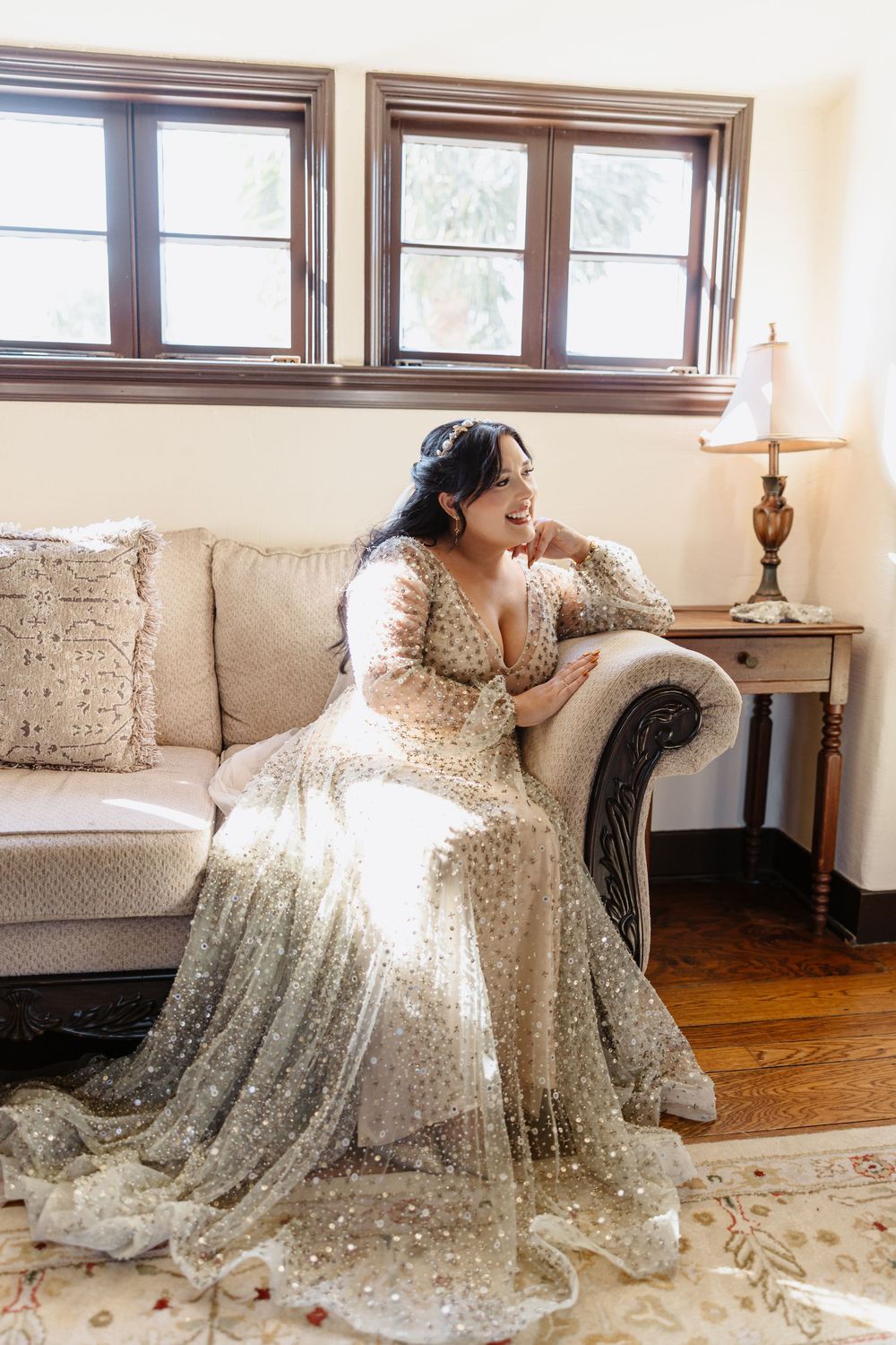 A sequence of photos showing someone in a sparkly white lace gown lounging on a beige couch in natural window light.