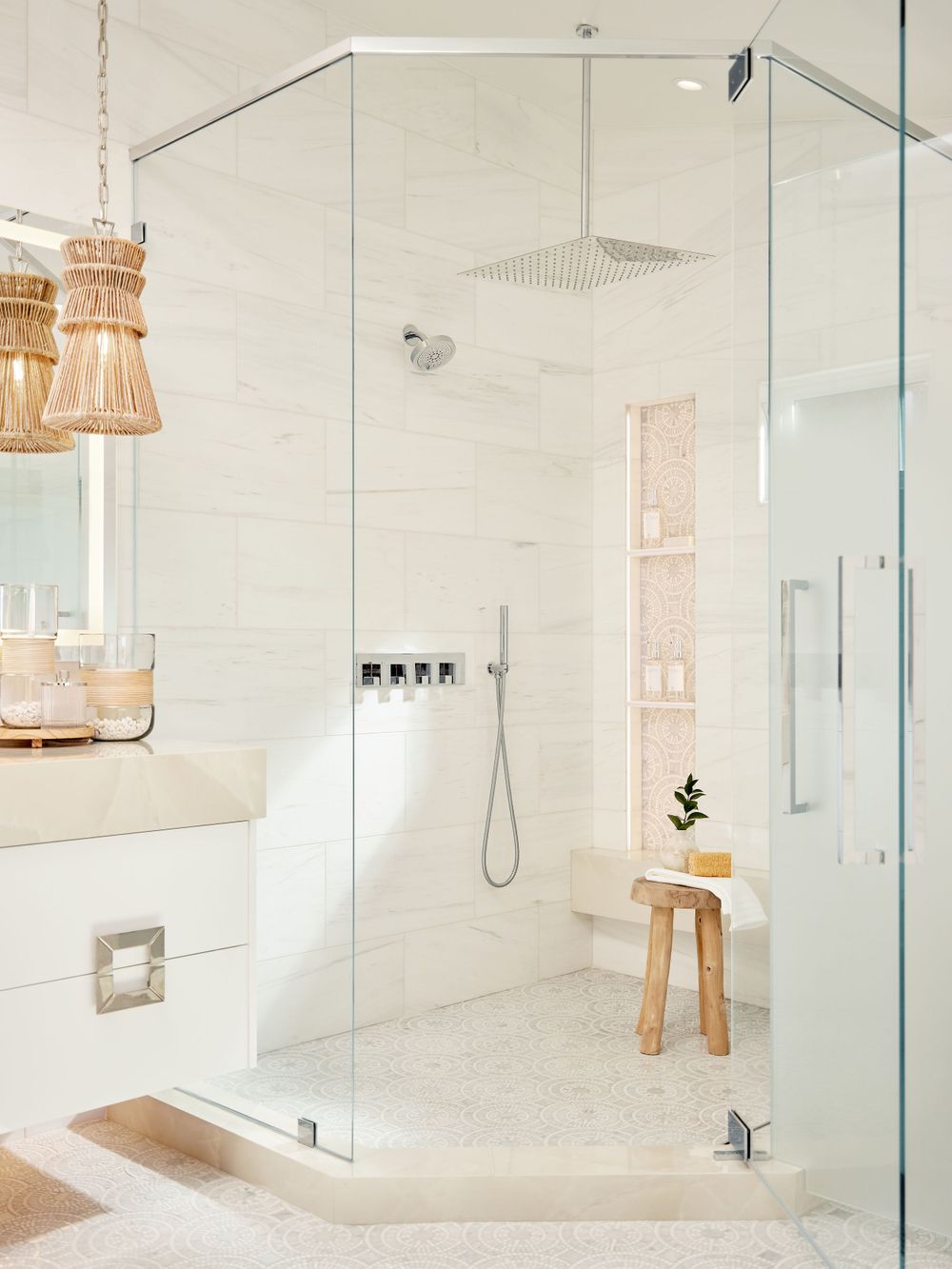 Spa-style walk-in shower with neutral tiles, bench seating, and natural light — bathroom photography by Khoi Ly.