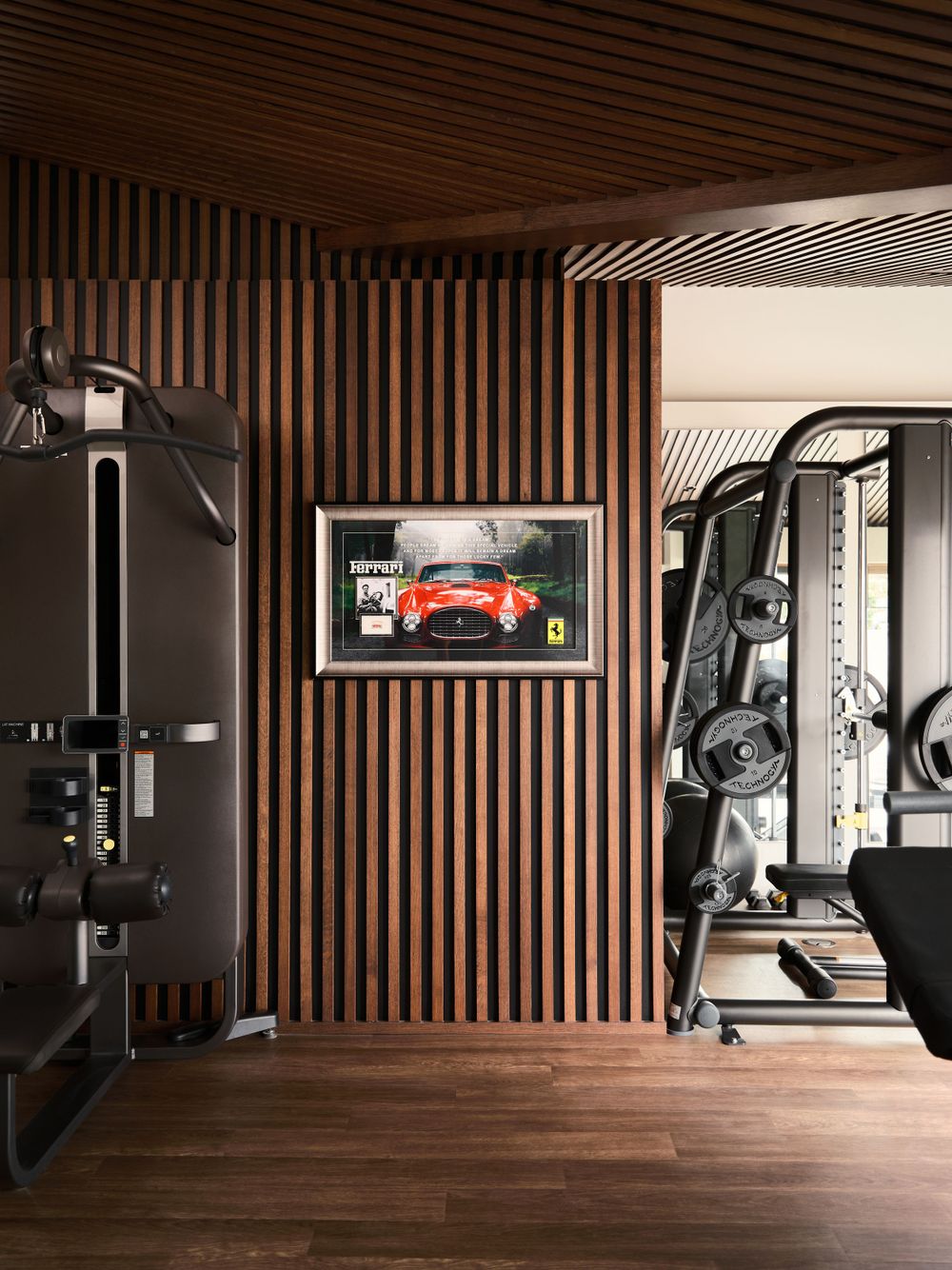 Contemporary home gym with wooden slat walls and integrated equipment — wellness space by Khoi Ly in La Jolla.