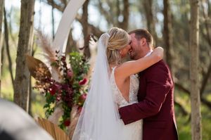 Emotional outdoor wedding ceremony moments captured in a sunlit forest setting.