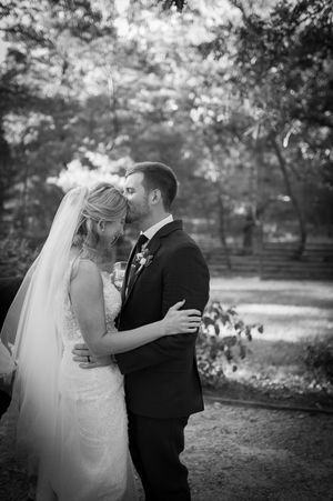 Black and white wedding portraits showing intimate moments between the newlyweds.
