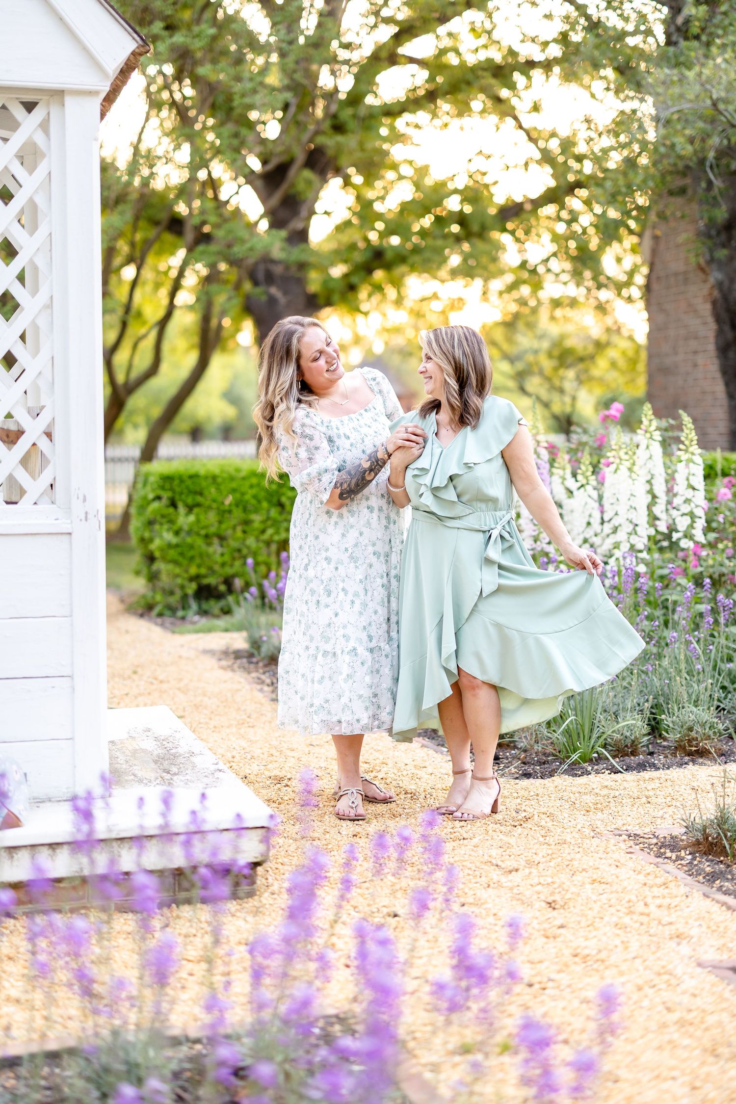 Sample gallery of a mother daughter photography session in a rose and foxglove garden in Colonial Williamsburg near Campbell's Tavern.
