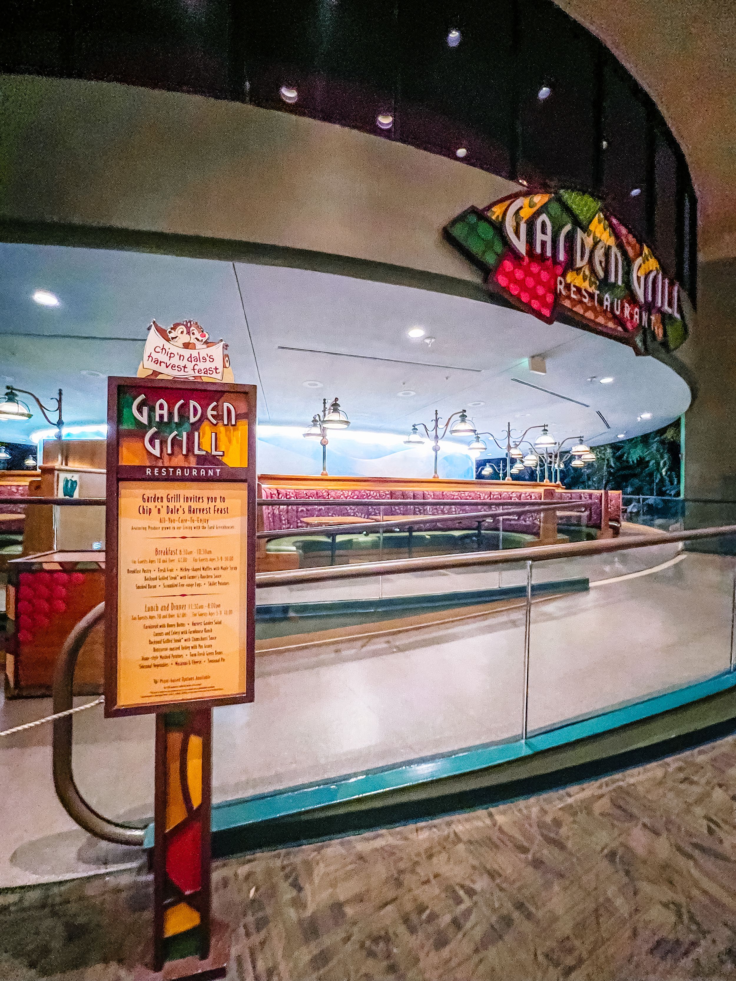 Inside view of Space Mountain attraction entrance with curved walls and illuminated signage.