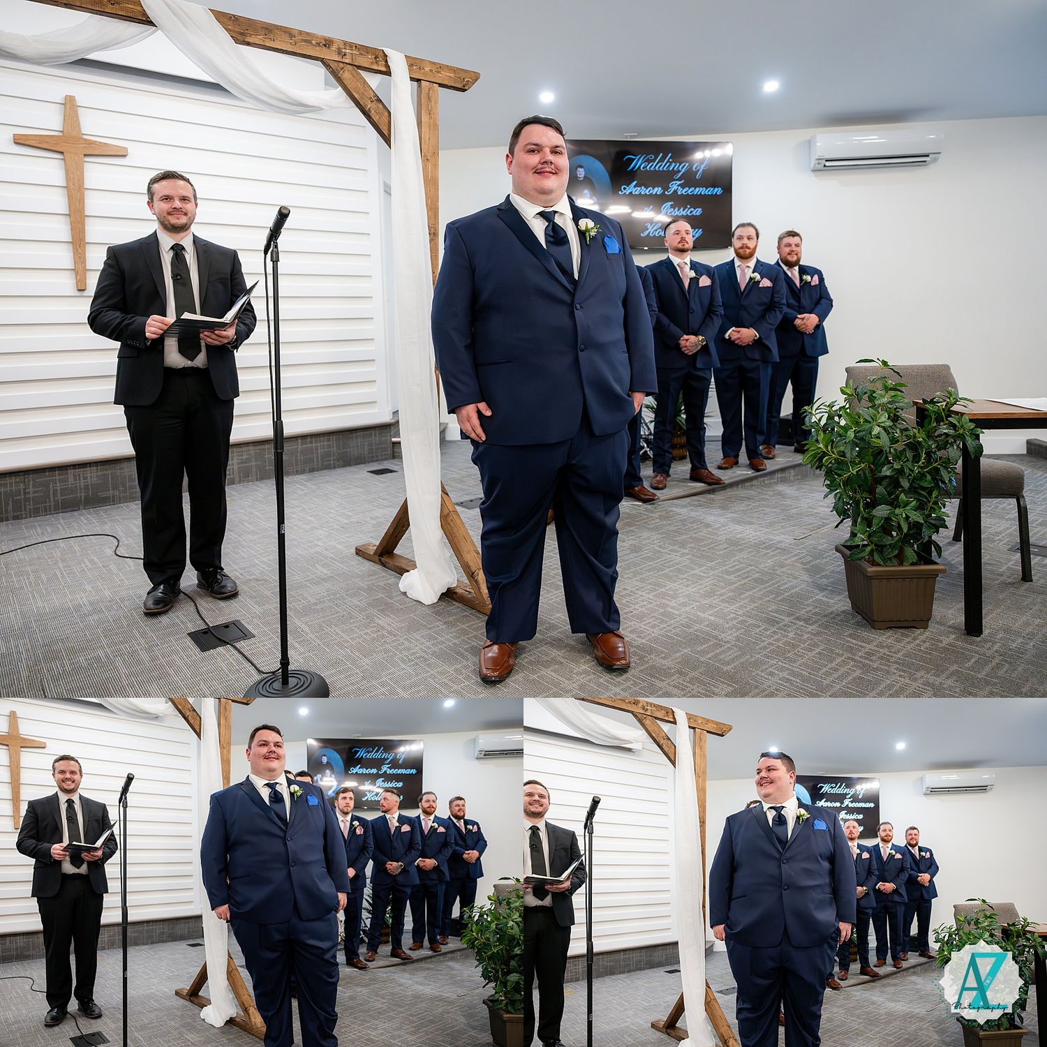 A wedding party in navy suits stands in formation at a modern chapel venue with white walls and wooden beams.