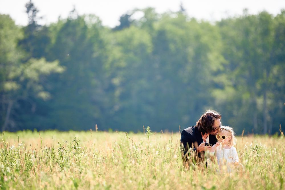 Emotional father-daughter moment in a wheat field at Blue Ridge Mountains wedding.