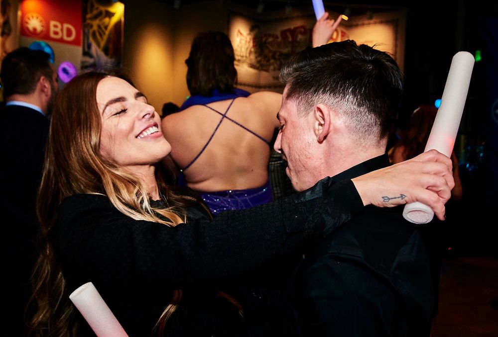 Candid photo of wife dancing with husband at Baltimore Museum of Industry wedding reception.