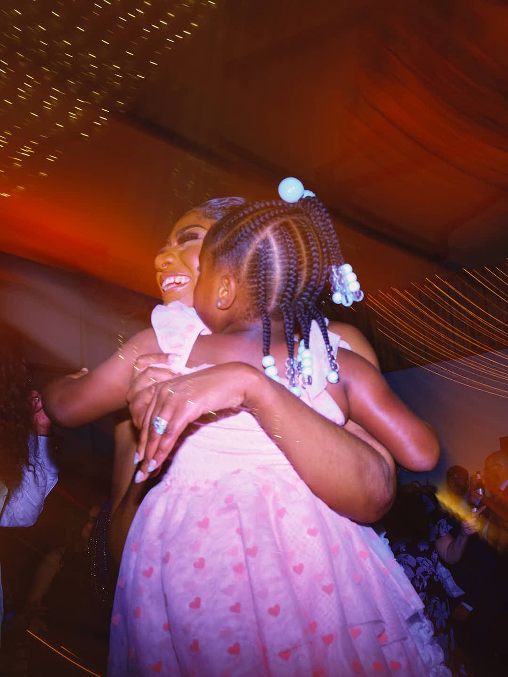 Candid reception photo of bride holding child on the dancefloor in Gettysburg, PA.