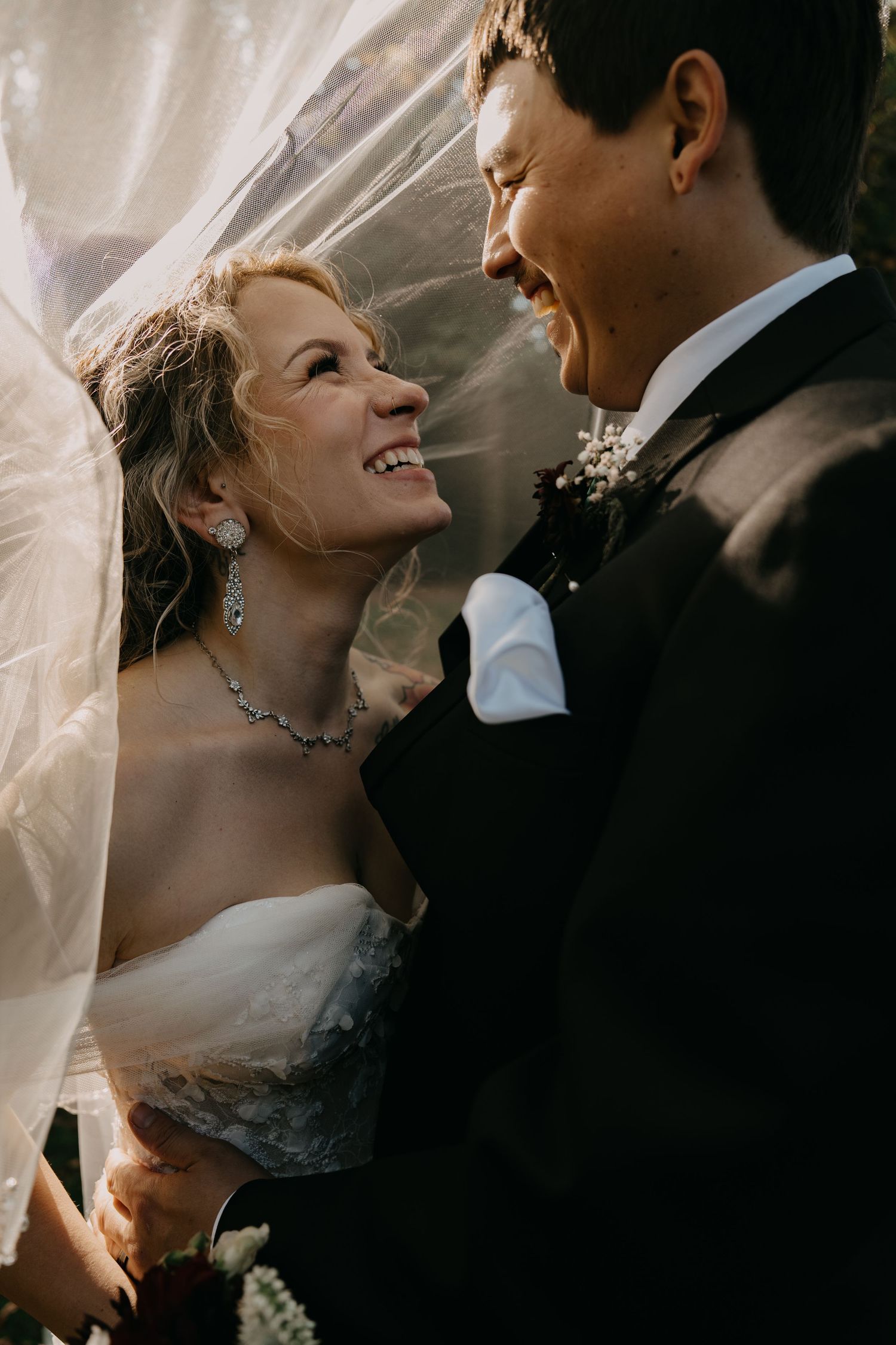 Three intimate wedding portraits show the couple sharing tender moments together with a delicate bridal veil.