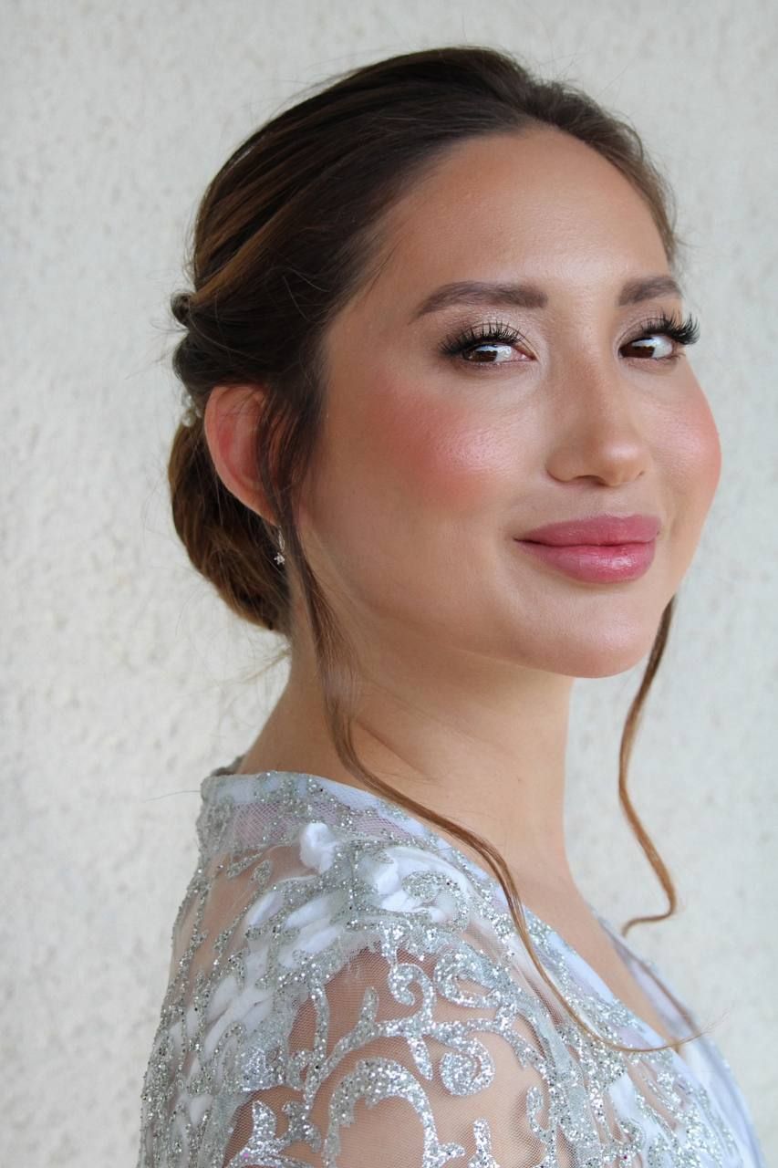 Cambridge bridal makeup artist creating soft glam wedding look.