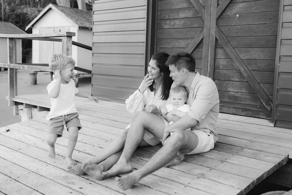 Big brother showing off to his little brother at the beach with his parents. fun morning session with Bump Birth and beyond. relaxed session