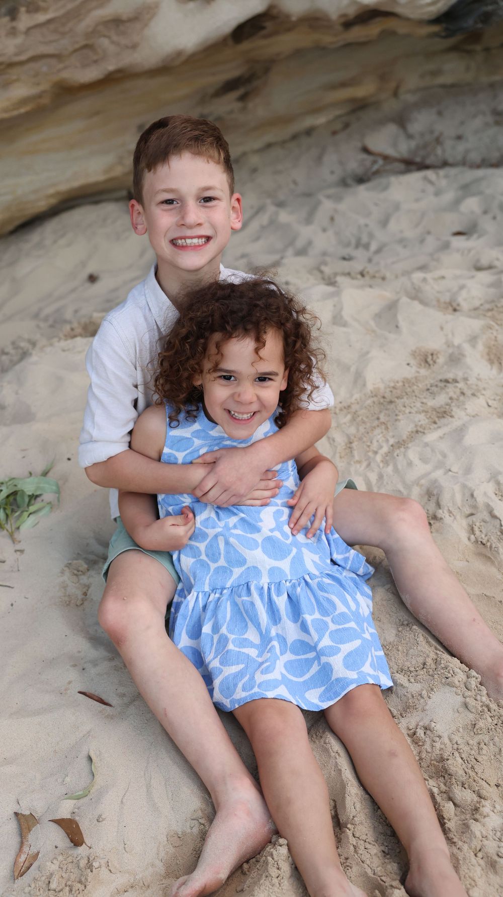 Cheeky smiles from siblings as the pose for their family photos in western Sydney Penrith. surrounding areas