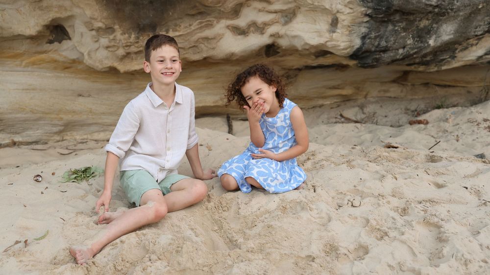 Brother and sister siling session at the beach for updating family photos. fun and meaningful session with photographer Steph Bump birth