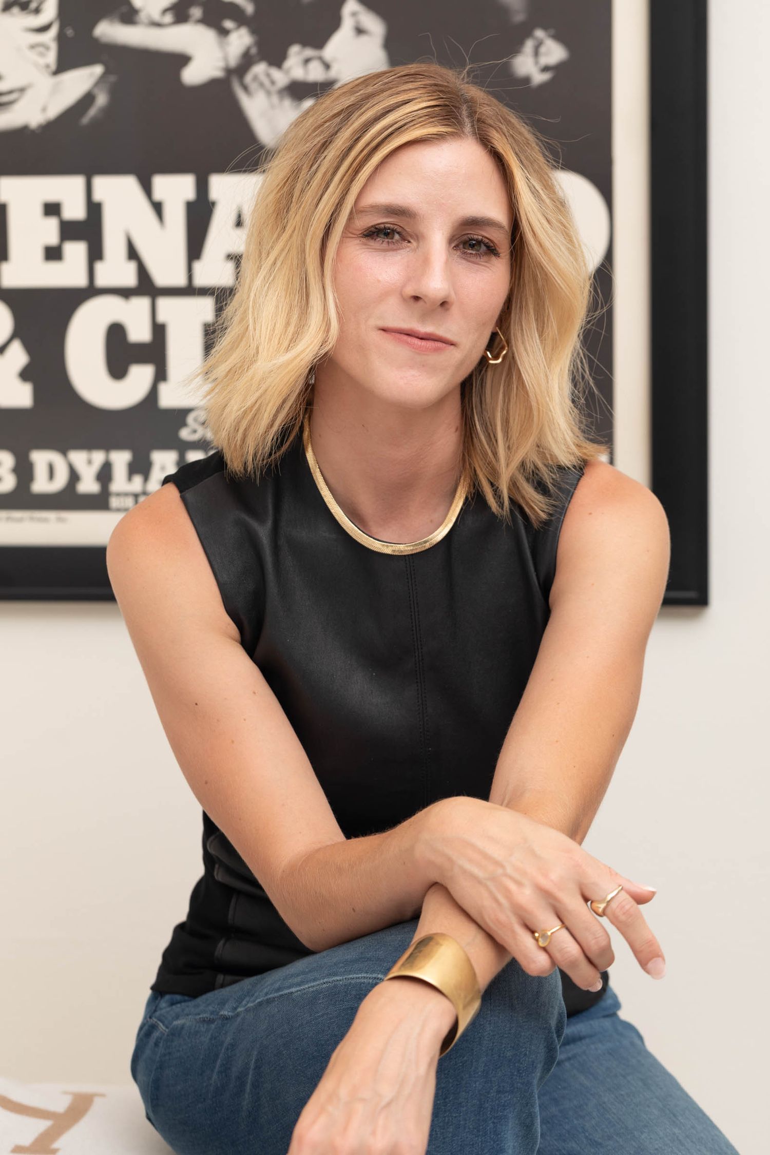 Portrait of chic blonde entrepreneur looking directly at us