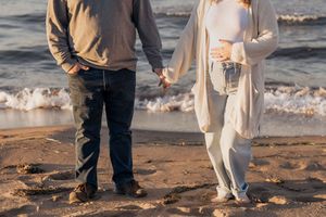 Pregnancy announcement photoshoot in Moncton New Brunswick, October beach maternity session at Parlee Beach, Shediac photographer