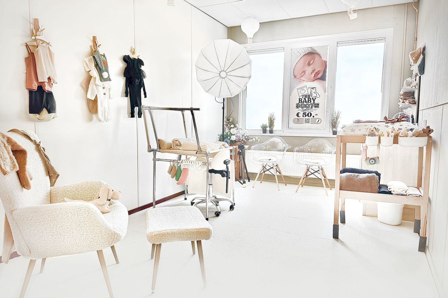 A bright white studio space showcases modern woodwork projects arranged along the walls and displayed on platforms.