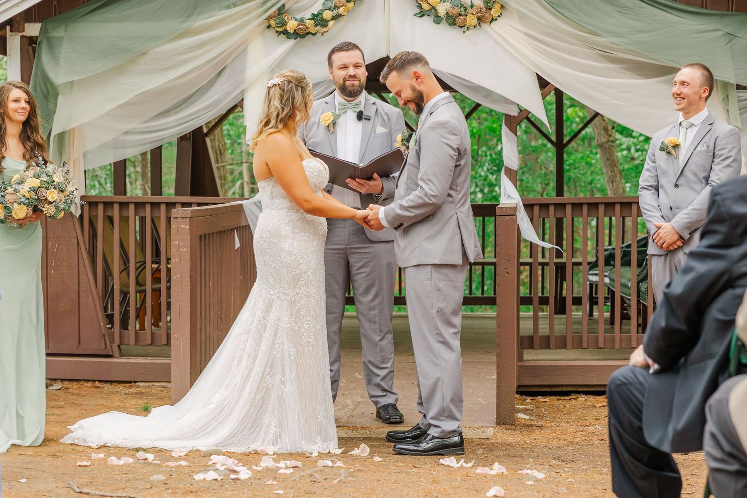 Wedding ceremony photographs displayed in a filmstrip style collage showing moments during an outdoor service.