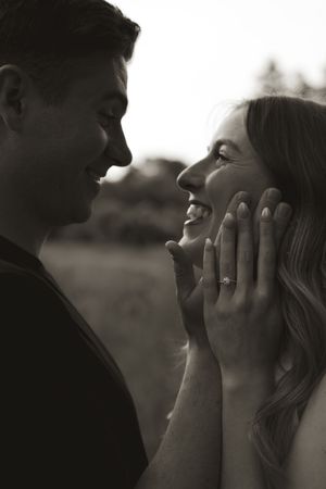 An intimate black and white portrait capturing pure joy between a couple.