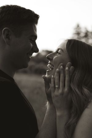A candid black and white photo showing genuine laughter and happiness.