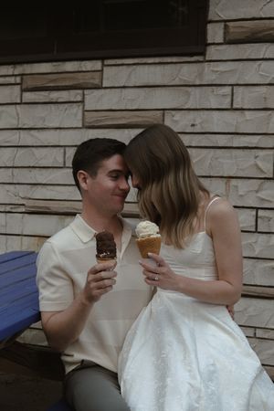 A sweet moment shared over ice cream cones in black and white photography.