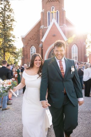 Bride and groom leaving Catholic church photos in Springfield, Illinois