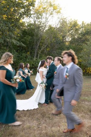 Full wedding party and bride and groom photos outside in a field in Springfield, Illinois