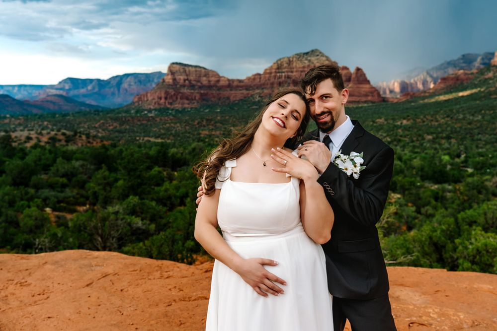 A joyful wedding moment shared against the backdrop of Sedona's red rock formations.