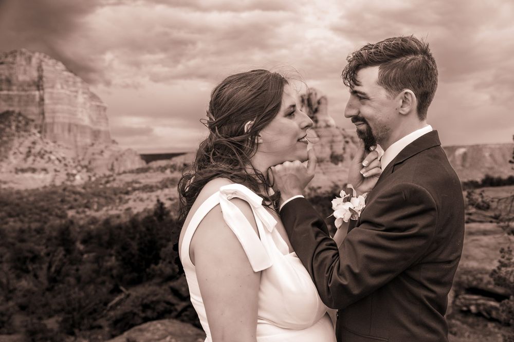 Vintage-style wedding portrait with Bell Rock & Courthouse Butte in background.