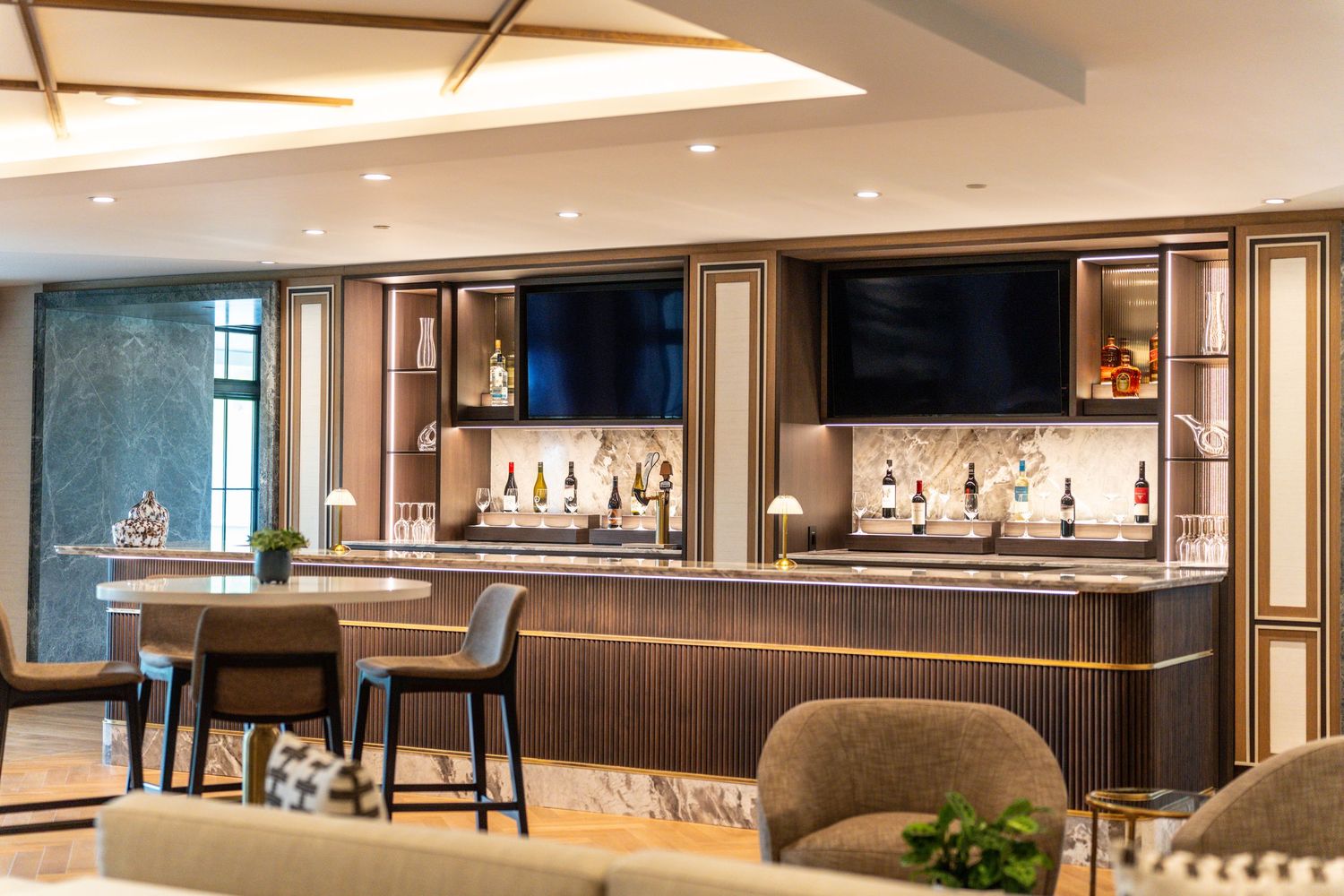 Modern bar area with sleek countertops and ambient lighting in an upscale venue at Whistlebear Golf Club.