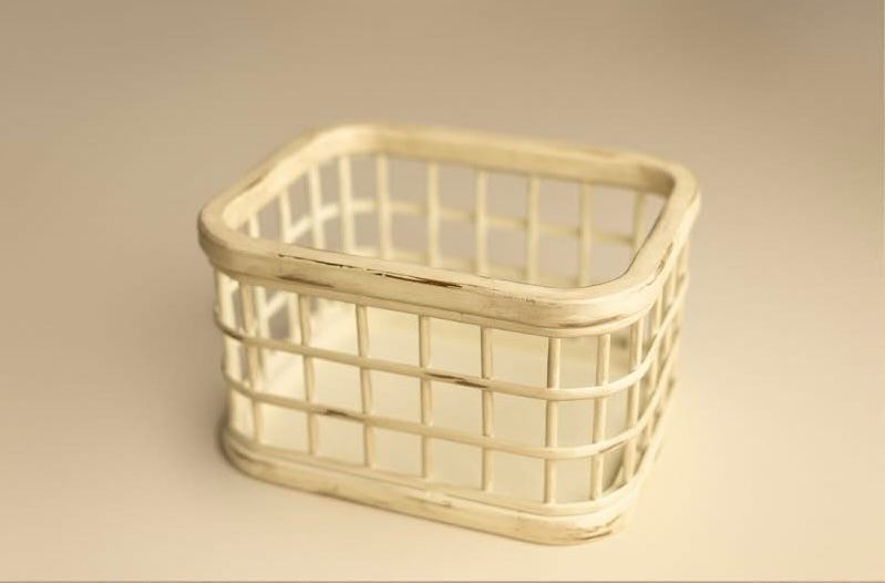 Two wood embroidery hoops used for crafting and needlework shown on a rustic wooden surface.