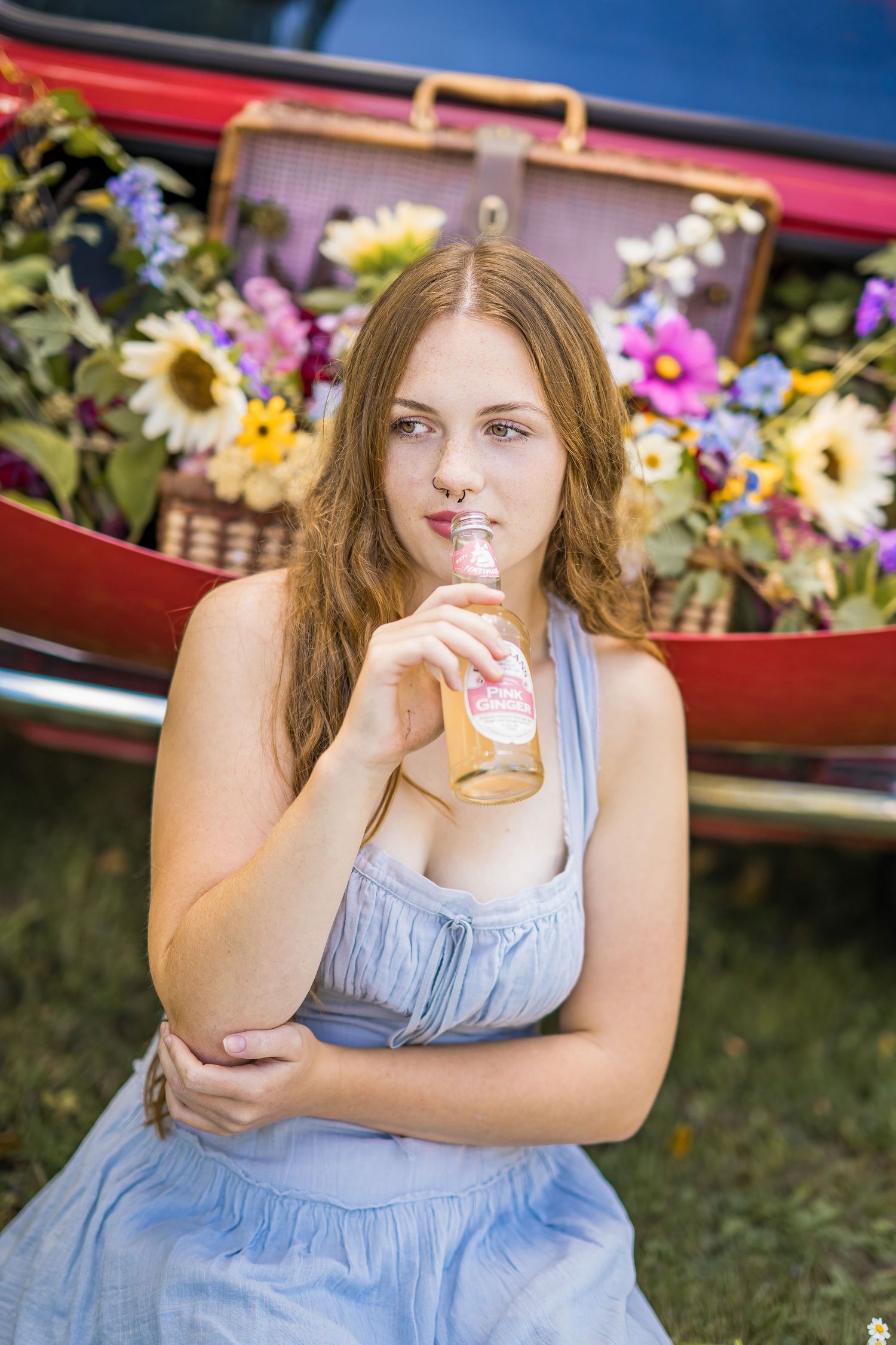 styled photography senior mini session with red classic mini Cooper car and seasonal flowers